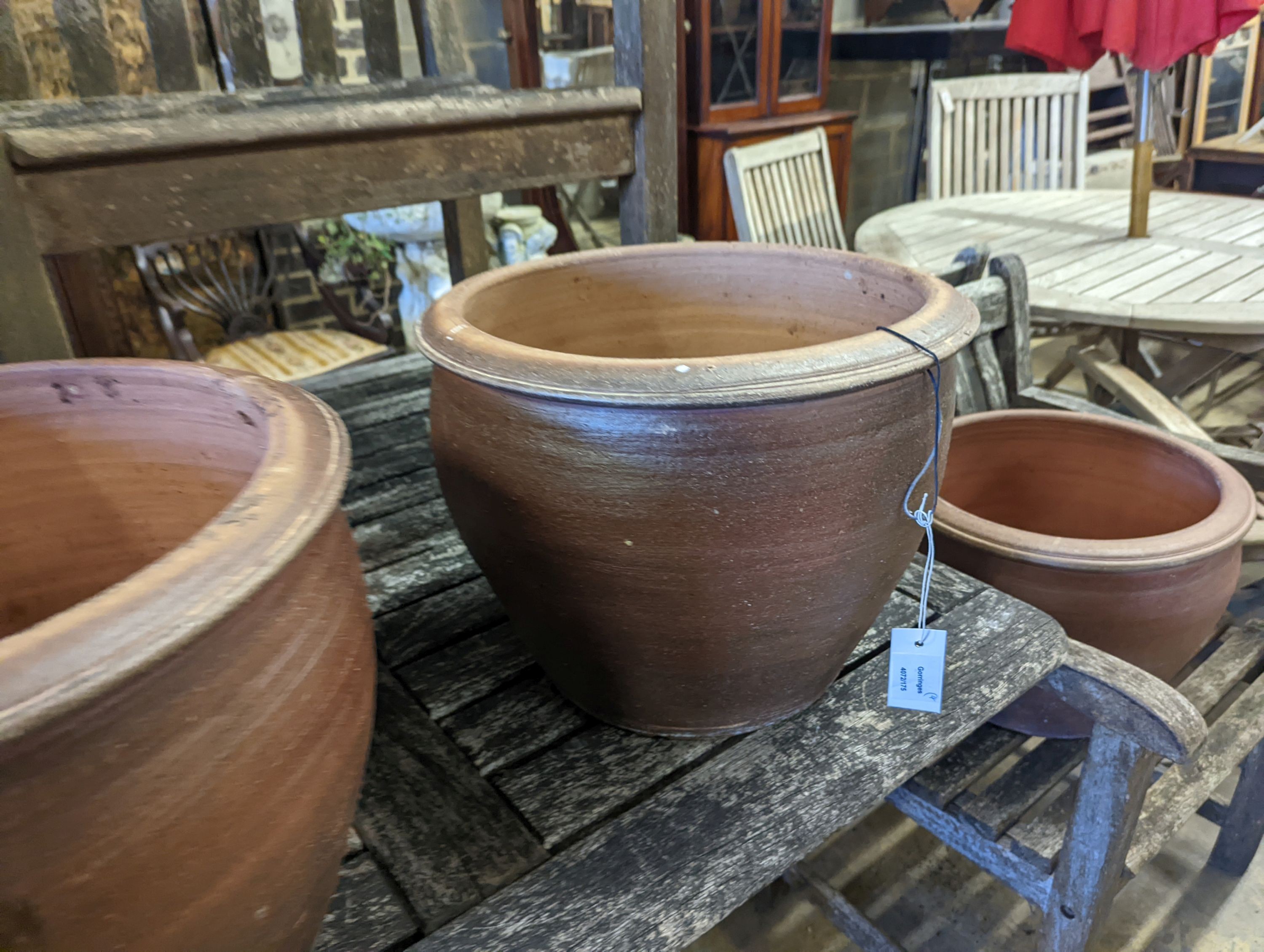 Four circular glazed earthenware garden planters, diameter 40cm, height 31cm